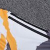 Chandal Real Madrid amarillo 2024-2025 hombro