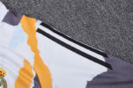 Chandal Real Madrid amarillo 2024-2025 hombro