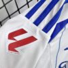 conjunto-niño-primera-equipacion-real-zaragoza-2024-2025-puño-derecho