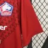 camiseta-lille-primera-equipacion-2024-2025-puño-izquierdo