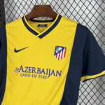 camiseta-atletico-de-madrid-segunda-equipacion-retro-2013-2014-puño-izquierdo