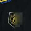 camiseta-manchester-united-tercera-equipacion-2025-2026-escudo