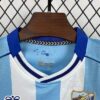 conjunto-niño-malaga-primera-equipacion-2025-2026-cuello