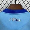 conjunto-niño-malaga-primera-equipacion-2025-2026-cuello-trasero