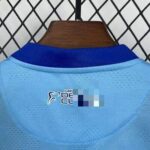 conjunto-niño-malaga-primera-equipacion-2025-2026-cuello-trasero