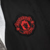 chandal-manchester-united-negro-gris-2024-2025-escudo-pantalon