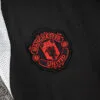 chandal-manchester-united-negro-gris-2024-2025-escudo-pantalon