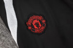 chandal-manchester-united-negro-gris-2024-2025-escudo-pantalon