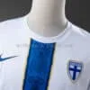 camiseta-filandia-primera-equipacion-2026-cuello