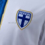 camiseta-filandia-primera-equipacion-2026-escudo
