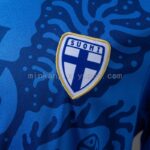 camiseta-filandia-segunda-equipacion-2026-escudo