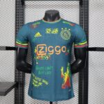 camiseta-ajax-edicion-especial-bob-marley-version-jugador-azul-2025-2026