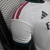 camiseta-real-madrid-primera-equipacion-version-jugador-2026-2027-puño-2