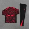 chandal-atletico-de-madrid-rojo-negro-2025-2026-1