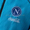 cortaviento-napoli-sky-blue-2025-2026-escudo