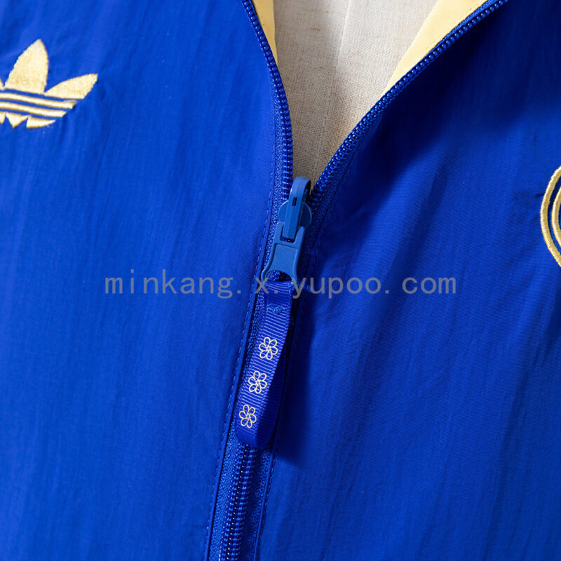 cortaviento-real-madrid-reversible-azul-y-amarillo-2025-2026-pecho