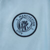 chandal-manchester-city-cremallera-baja-celeste-2025-2026-escudo