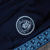 chandal-manchester-city-cremallera-baja-celeste-2025-2026-escudo-pantalon