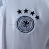 camiseta-alemania-polo-blanco-2025-2026-escudo