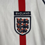 camiseta-inglaterra-primera-equipacion-manga-larga-retro-2002-escudo